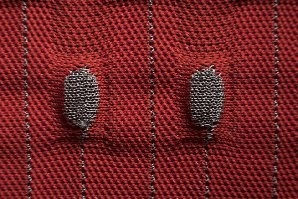 Architecting textile sensors with machine knitting