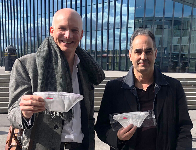 Left to right. Carlo Centonze and Dr Thierry Pelet holding the first prototype of HeiQ Viroblock NPJ03 treated face masks.jpg