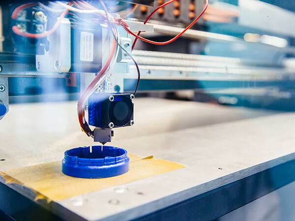 freshly-printed-blue-plastic-detail-platform-3d-printer--TN.jpg