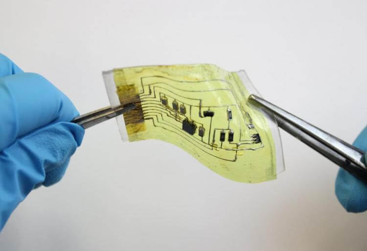 This new 'electronic skin' device can stretch by 60% in any direction without losing its functionality. A user wears a device on the ankle. Image credit Chuanqian Shi.jpg