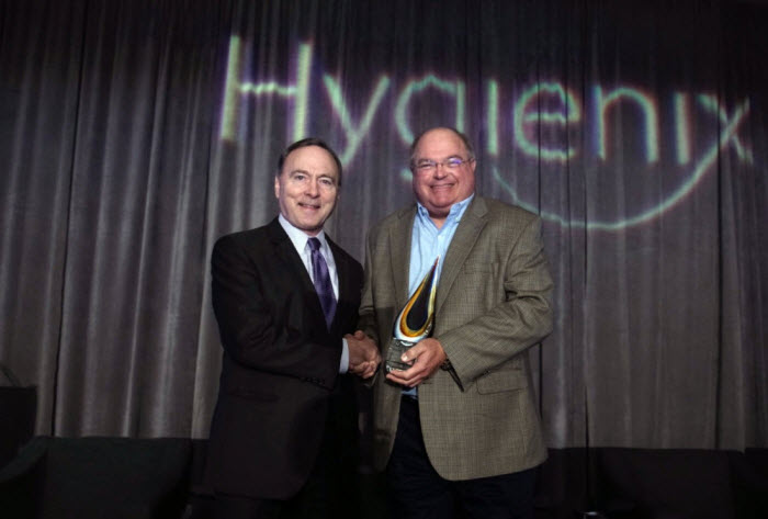 Joseph Howard (right ) Accepts The Hygienix Innovation Award From INDA President Dave Rousse